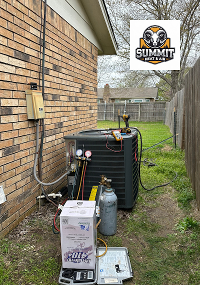 Expert HVAC professional calibrating AC thermostat for a Broken Arrow, OK home in preparation for summer