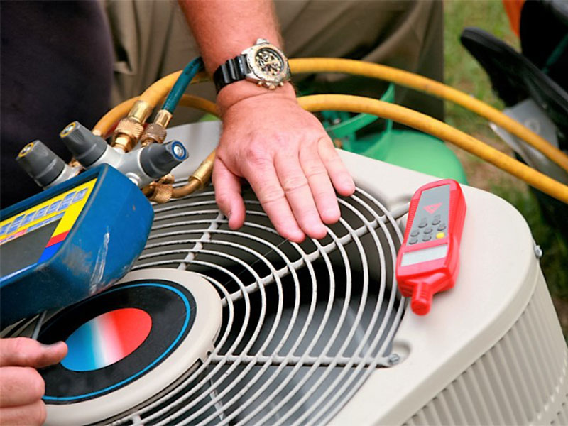 Professional HVAC contractor in Osage County, OK installing residential air conditioning system