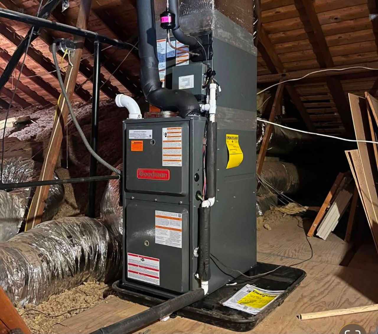 Certified technician reviewing installation checklist for a new furnace in Sand Springs, OK home